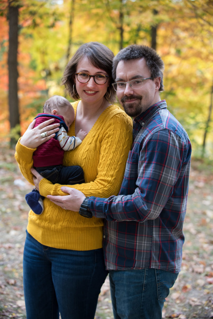 Fall portrait of young family with baby