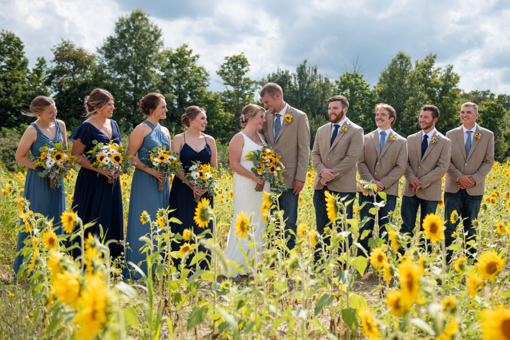 Wedding party in sunflower field