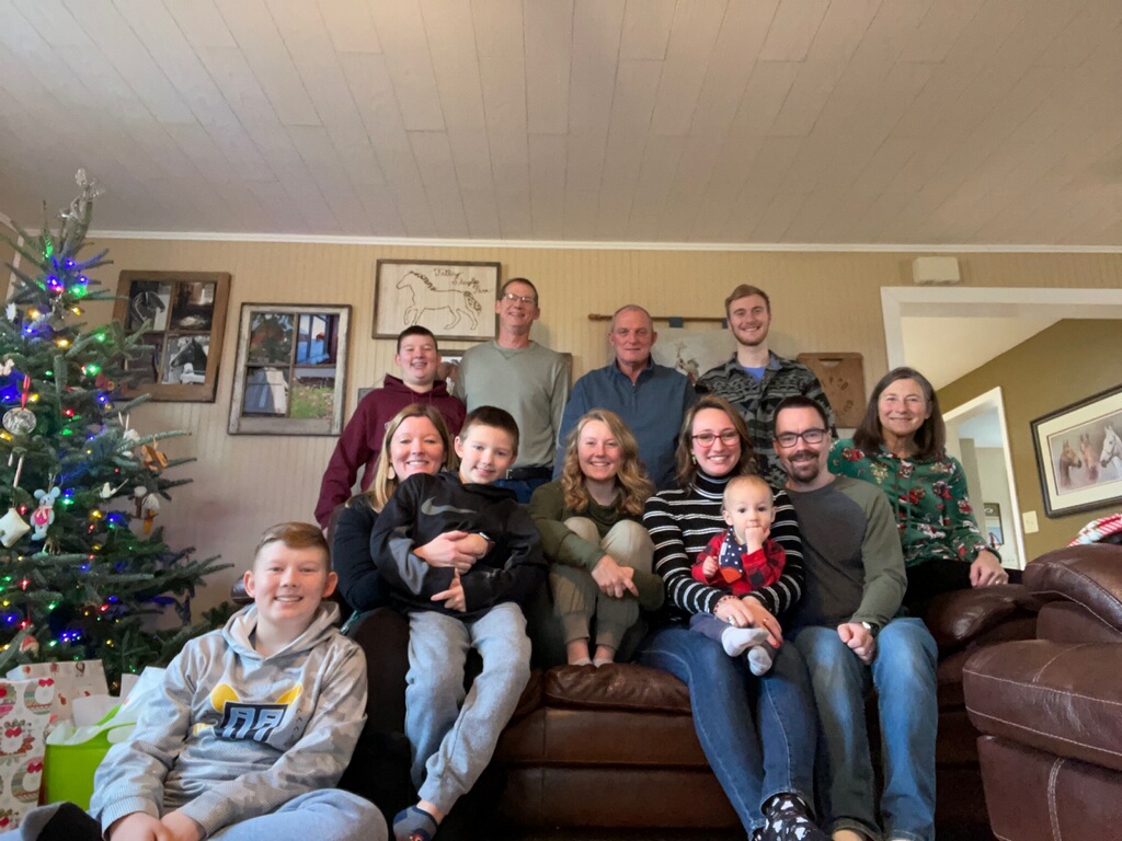 Family Christmas photo in living room